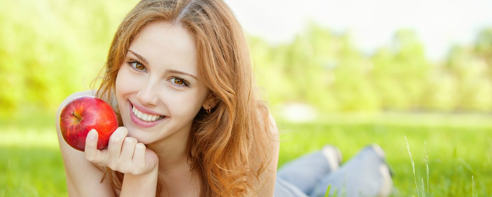 woman smiling after receiving dental implants in richmond indiana